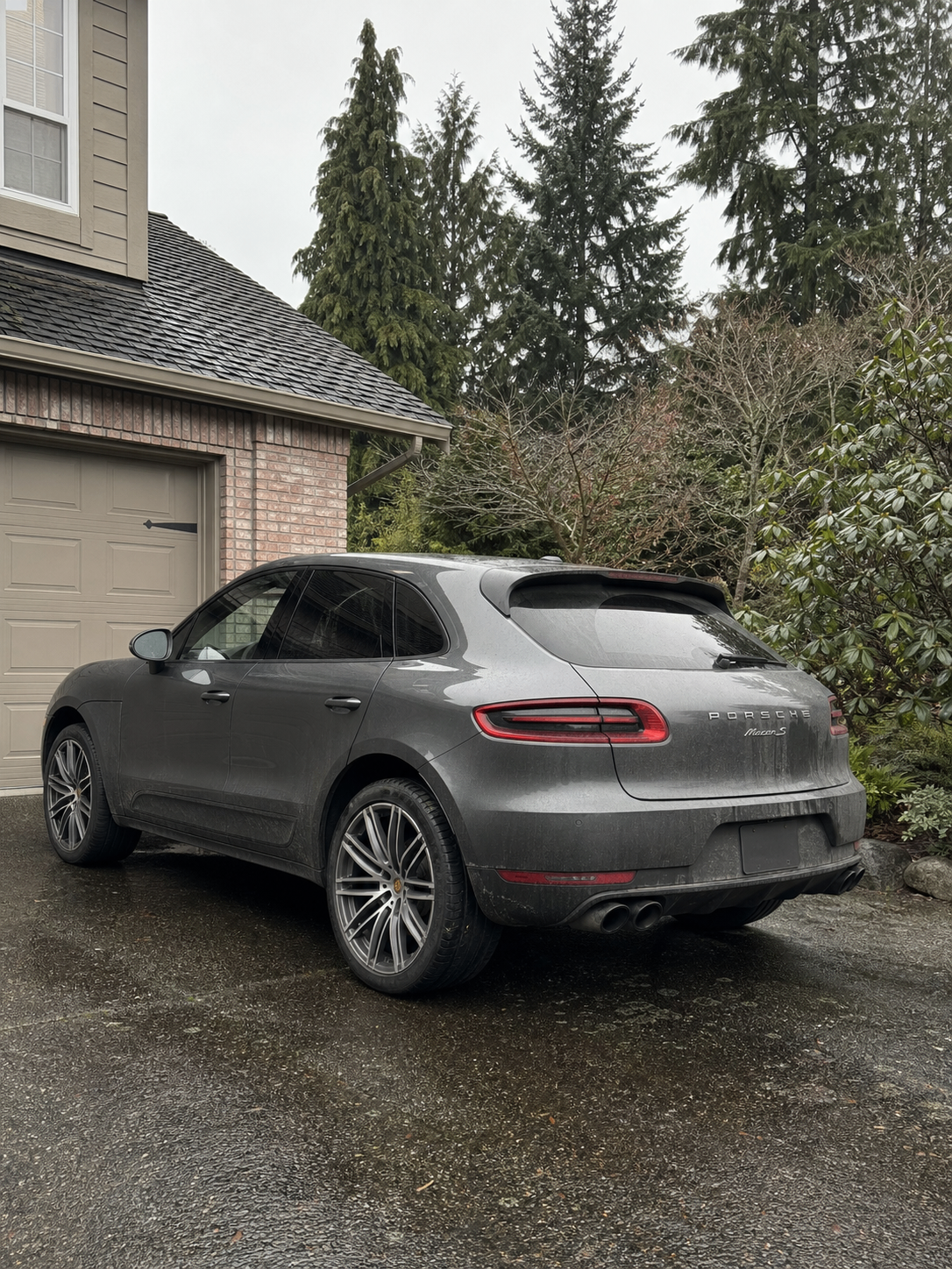 Dirty Porsche Macan S covered in road grime and water spots before detailing